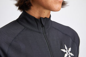 Black snowboard woman's one piece thermal base layer.