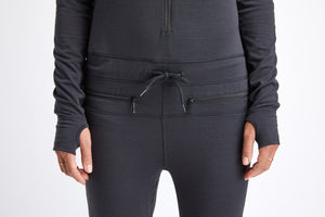 Black snowboard woman's one piece thermal base layer.